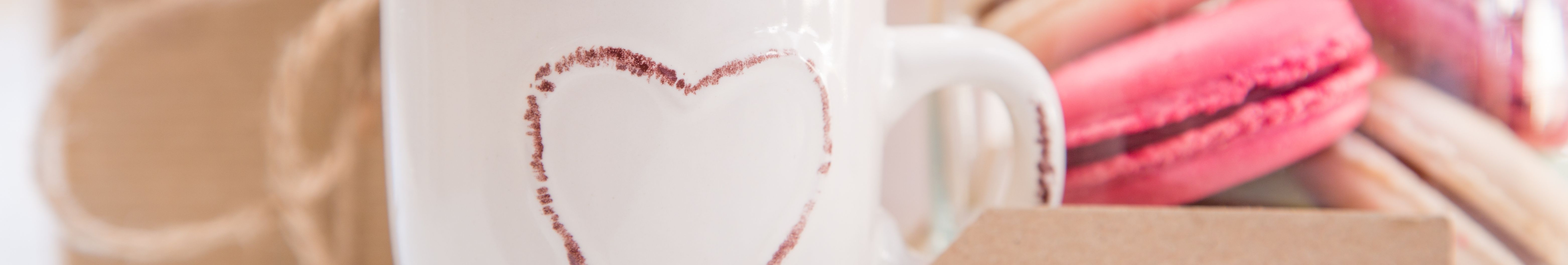 Coffee mug with cookies in background